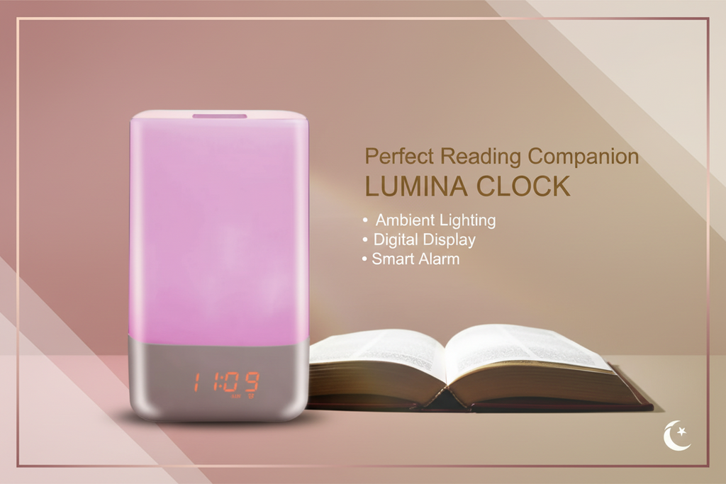 Pink electronic device with digital display next to an open book on a dark background